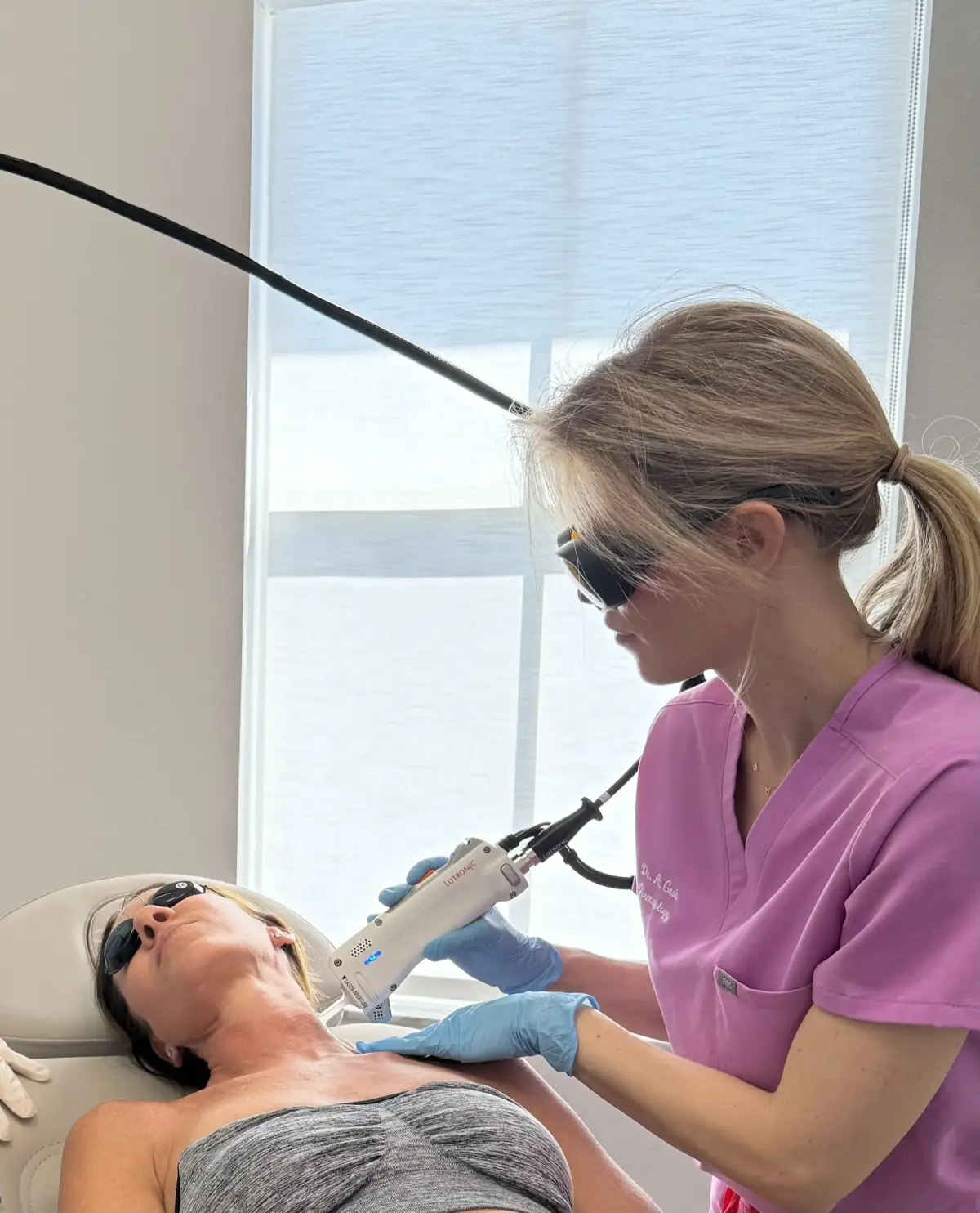 Dr. Alexandra Grob performing a laser dermatology treatment